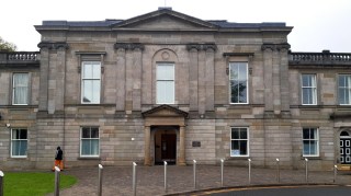 The charges at Dumbarton sheriff court relate to nine students and are alleged to have taken place between September 2004 and July 2019